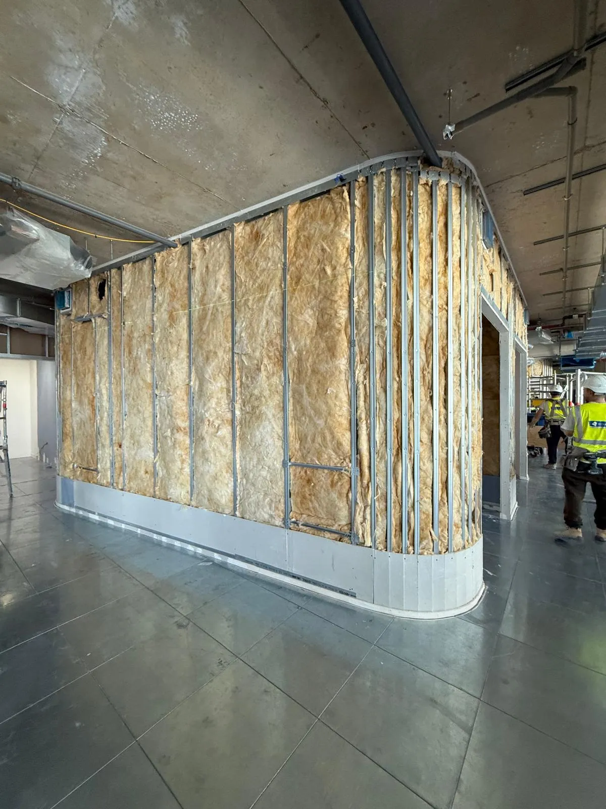 Curved insulated partition during installation
